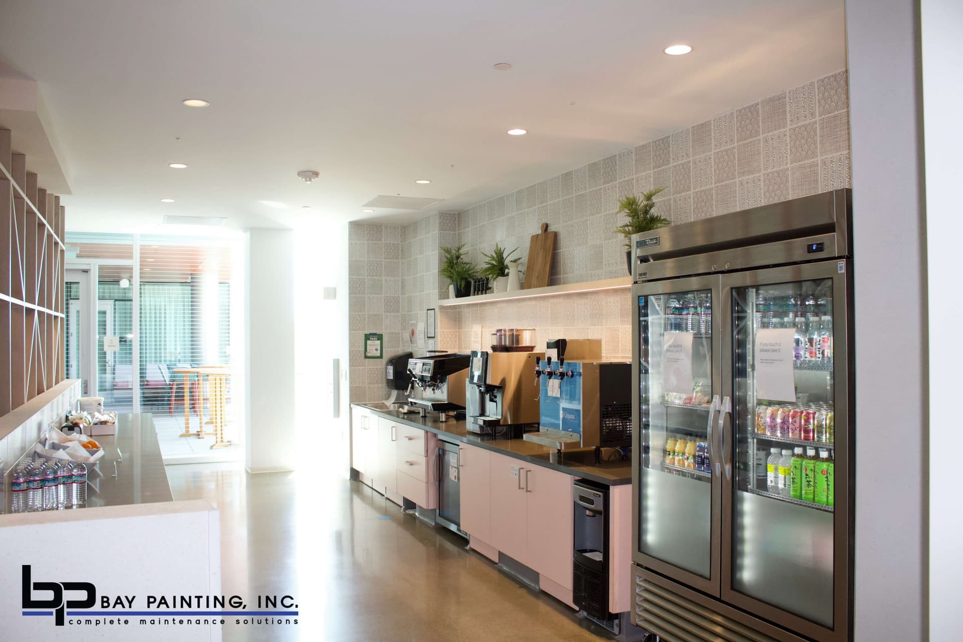 Painted break room and beverage station in a commercial office building
