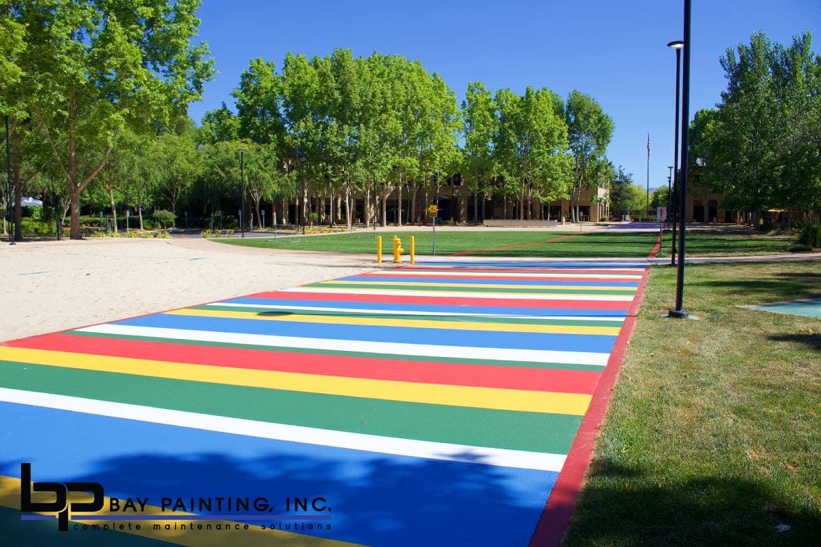 Finished multi-color striped pedestrian walkway at a corporate campus